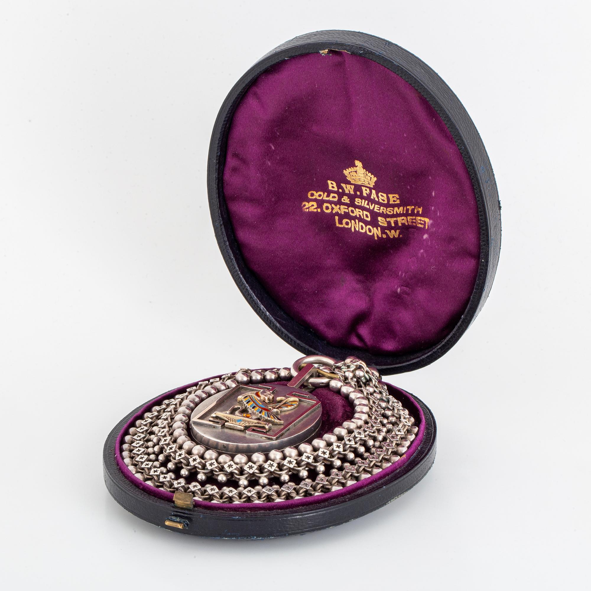 A LOCKET with partly silver and enamel.