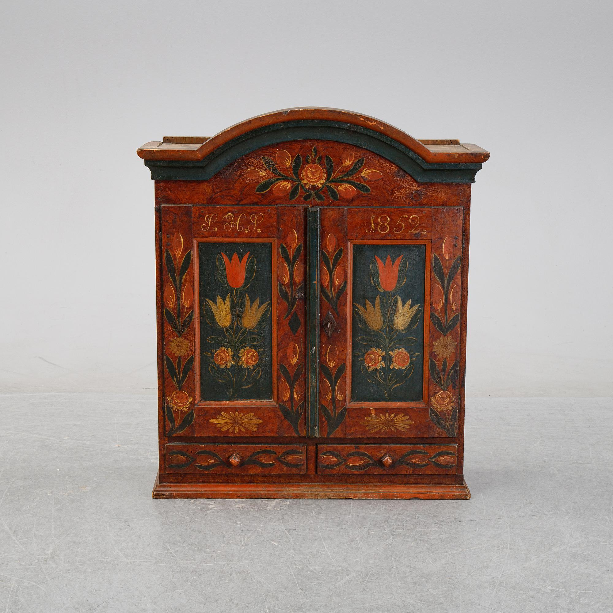A Swedish provincial painted wall hanging cabinet, dated 1852.