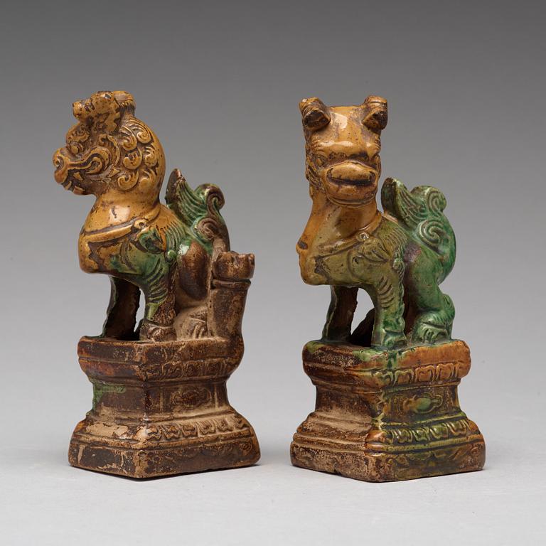 A pair of green and yellow glazed joss stick holders, Ming dynasty (1368-1644).