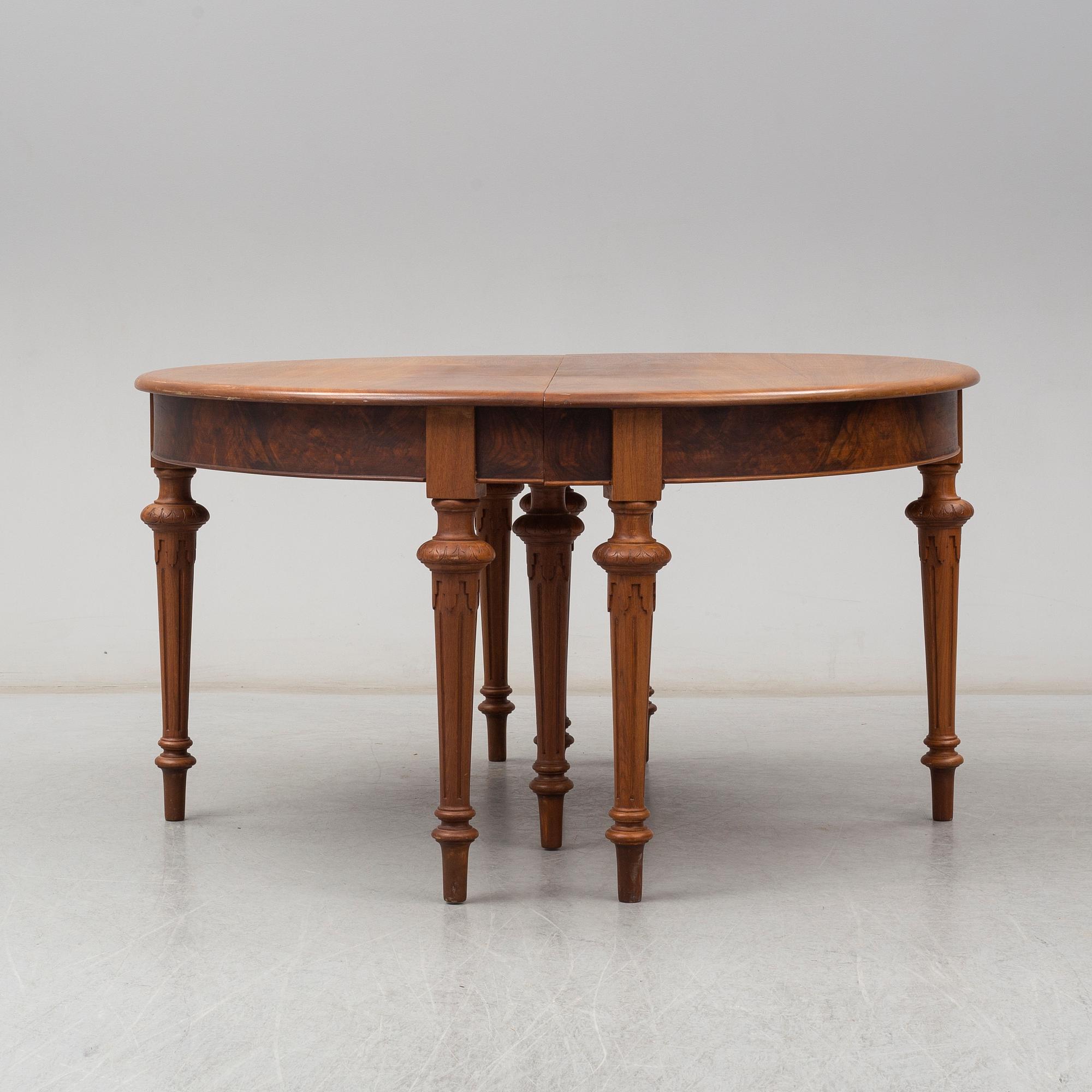 A DINING TABLE, second half of the 19th century. 5 painted leaves included.