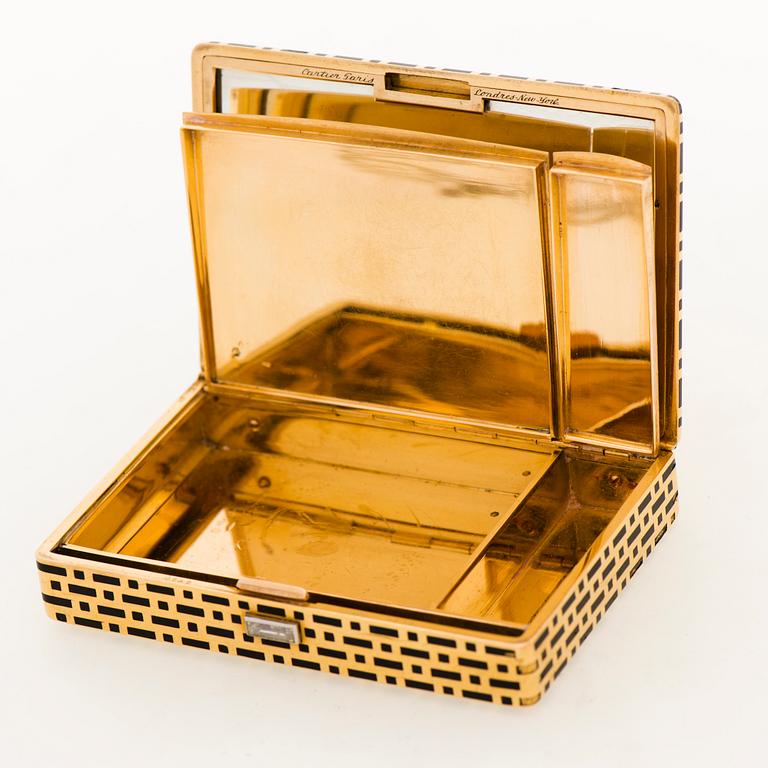 A CARTIER VANITY CASE, 18K gold, enamel, baguette cut diamond. France 1930s.