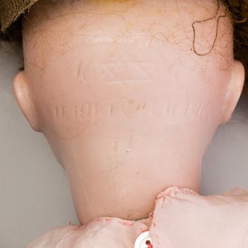 A Simon & Halbig 117n bisque head doll, Germany.