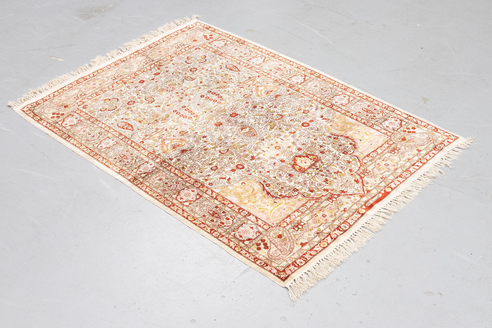 A rug, Old silk Hereke, ca 152 x 110 cm.