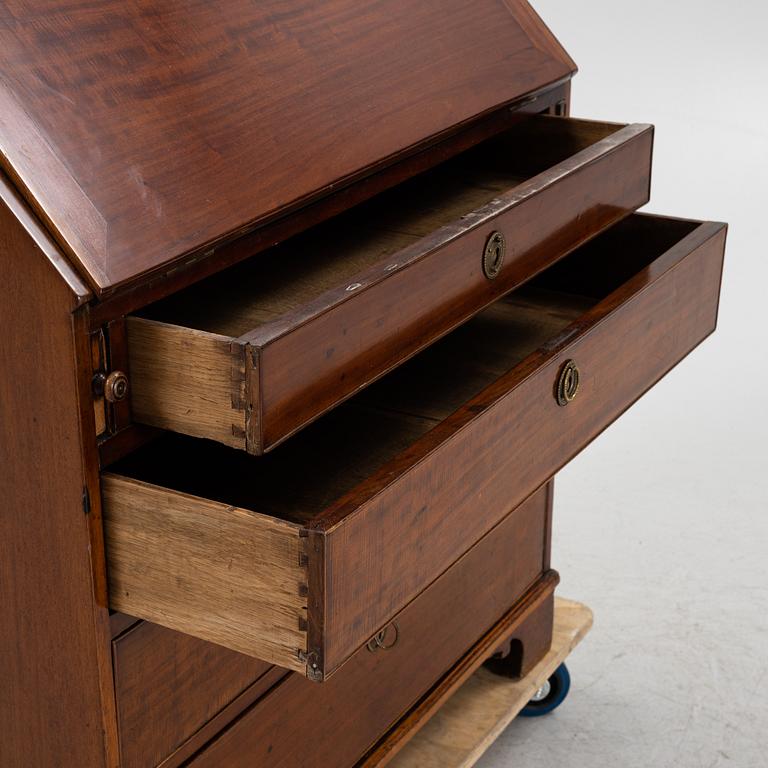 A mahogany veneered secretaire, early 19th Century.