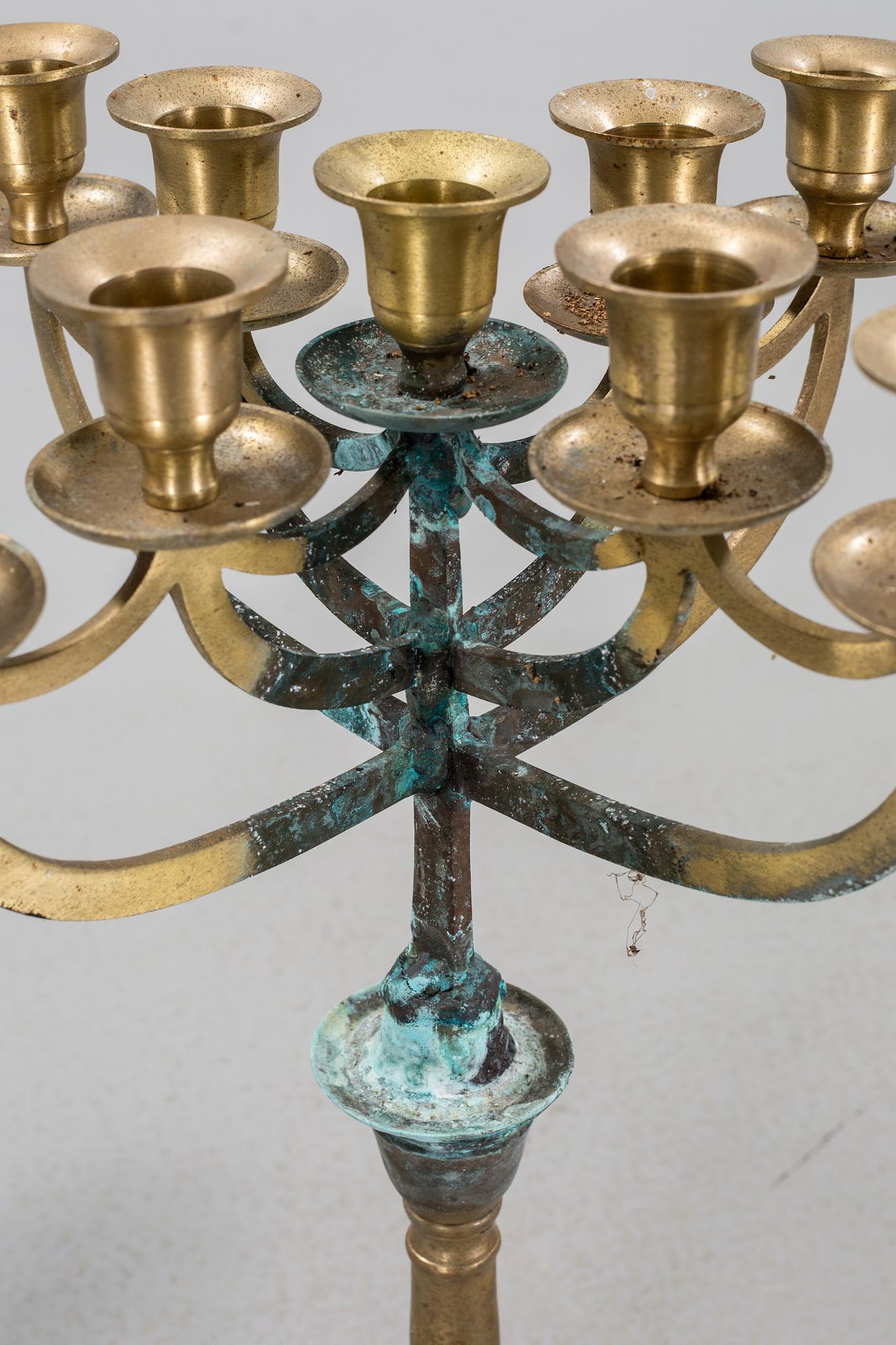 a metal sculpture group in eight parts, partly signed.