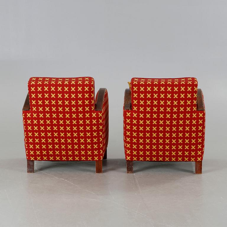 A pair of 1930s armchairs.