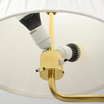 A pair of brass and leather floor lamps, Örsjö Designe, 21st century.