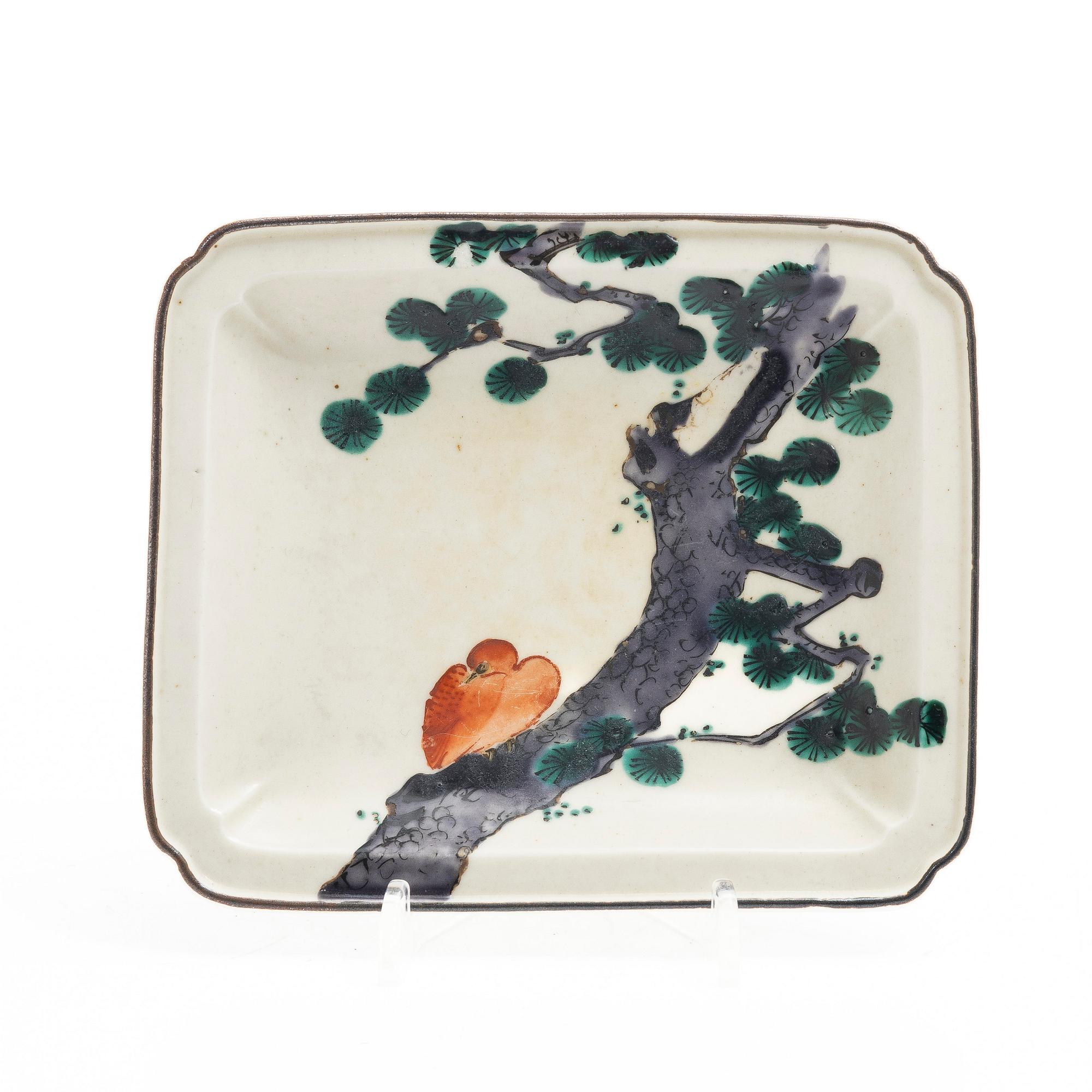 A small Japanese gilt copper box with cover and a porcelain dish, 19th century.