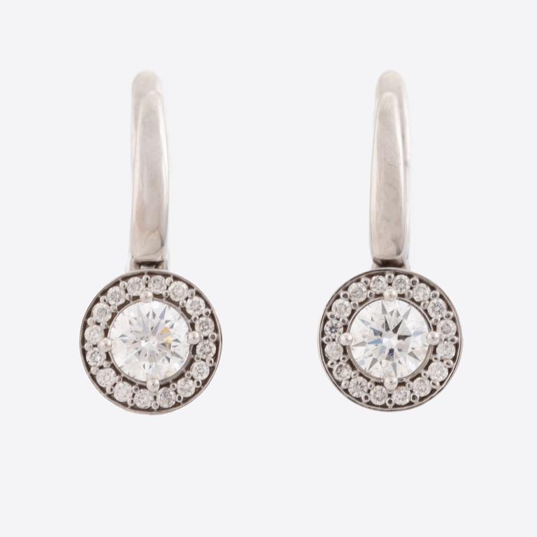 Brilliant-cut diamond earrings.