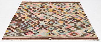 A Kelim carpet, c. 240 x 178 cm.