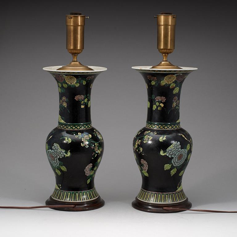 A pair of famille noir vases mounted as lamps, Qing dynasty, 19th Century.