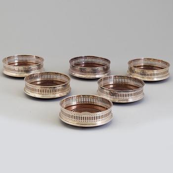 Six mahogany and sterling silver coasters, Carrs of Sheffield, Shefield, England 2003.