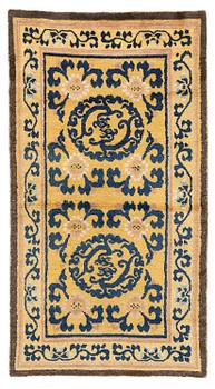 1208. An antique yellow ground Ningxia rug, Qing dynasty, 18th century. c. 152x83 cm.