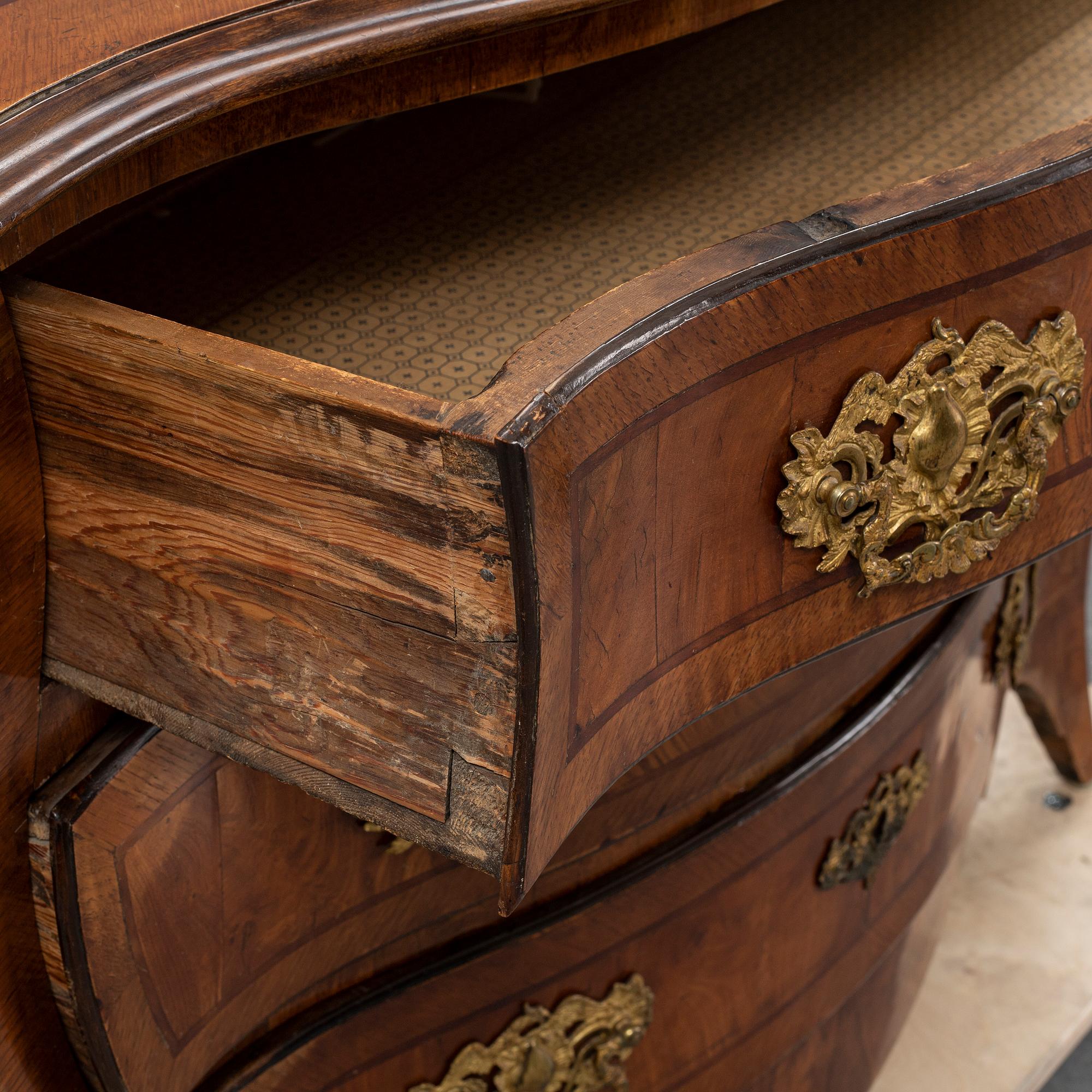 a mid 1700's rococo chest of drawers.