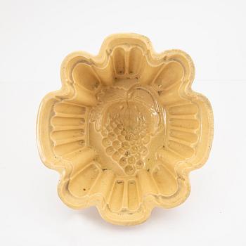 A set of five glazed earthenware moulds from Höganäs around 1900.