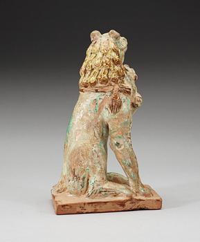 A green and yellow glazed lion with a cub, Song dynasty (960-1279).