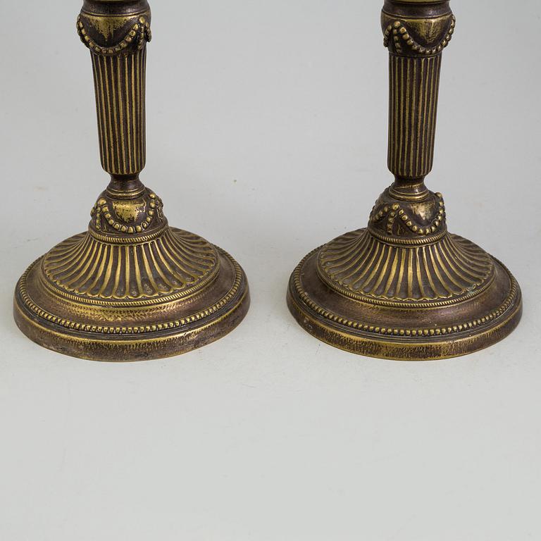 A PAIR OF BRONZE GUSTAVIAN CANDLESTICKS, 18th century.