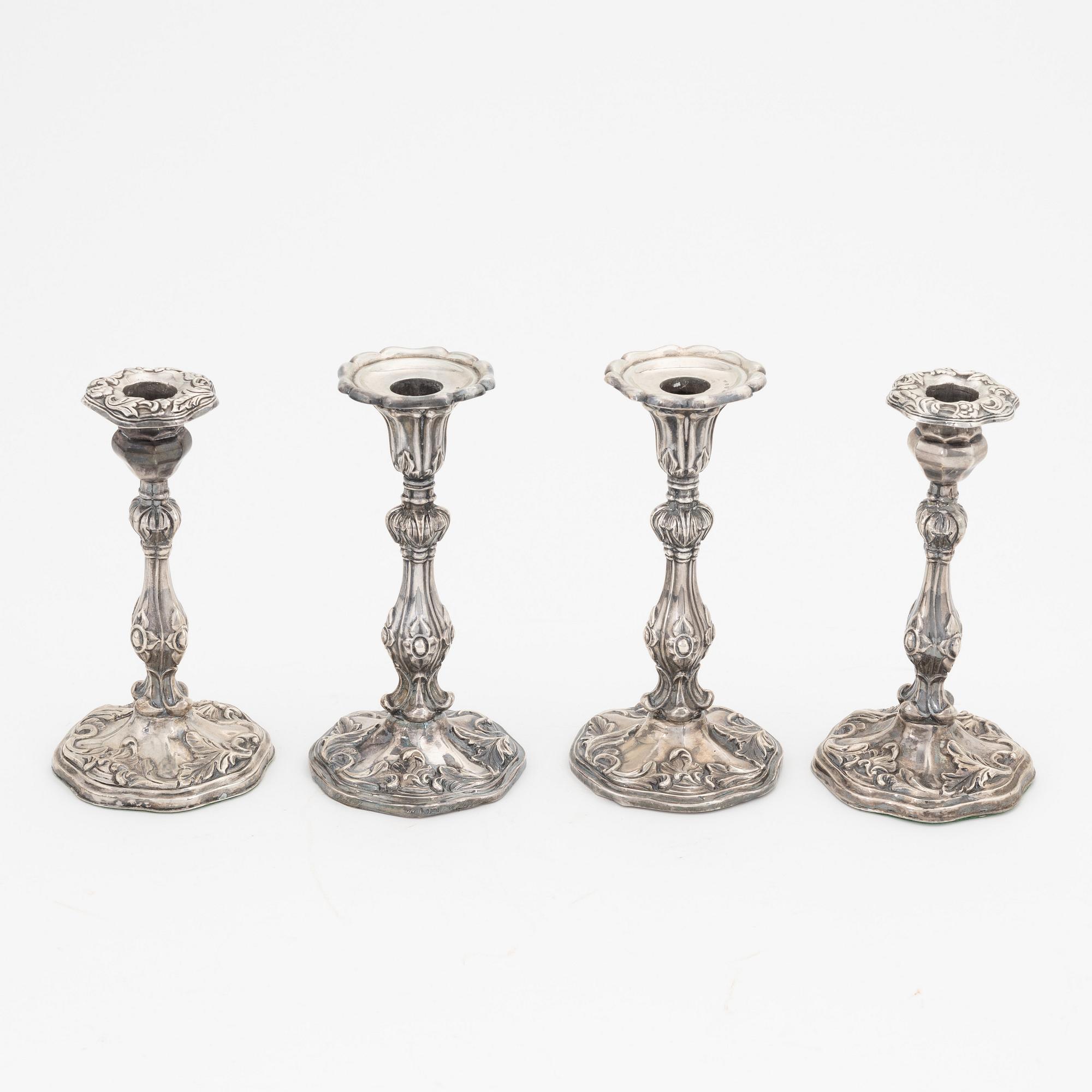 Two pairs of Swedish silver candlesticks, mark of A Lundqvist, Stockholm 1847 and JW Laurén, Stockholm 1854.