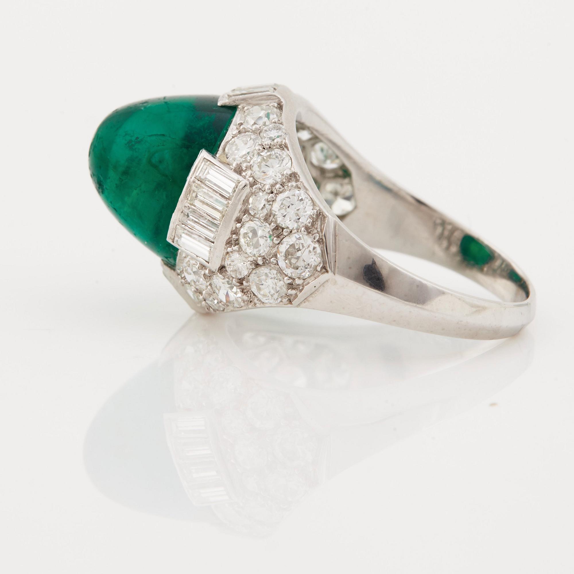 A cabochon-cut emerald, baguette, single and brilliant-cut diamond ring.