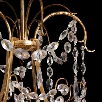 A German Louis XVI ormolu and cut-glass nine-light chandelier attributed to Johann Christoph Ermisch, late 18th century.