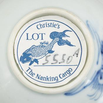 A group of three Chinese porcelain cups, two sacuers and a small teapot, Qing dynasty, 18th century.