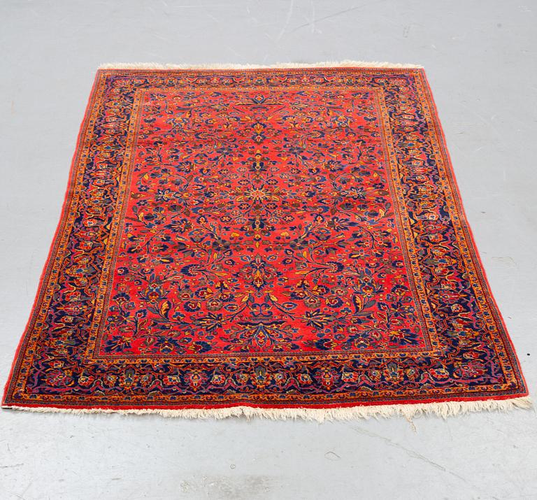 A rug, a semi-antique Kashan, ca 210 x 130,5-134 cm.