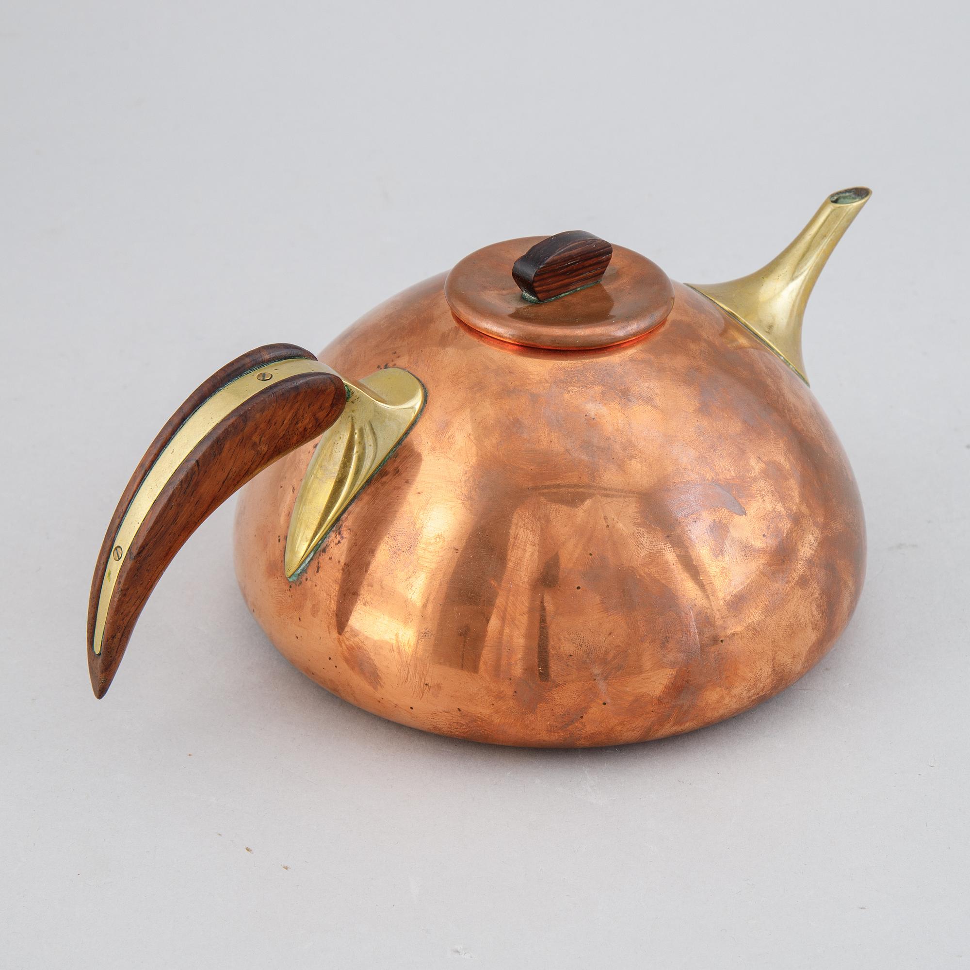 A copper, brass and rosewood teapot, Illums Bolighus, Denmark, 1950's.