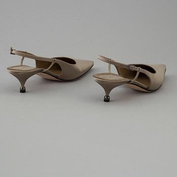 Green silk slingbacks by Sergio Rossi.