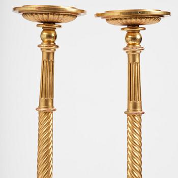 A pair of late Gustavian giltwood torchères by J. Frisk (master in Stockholm 1805-24).