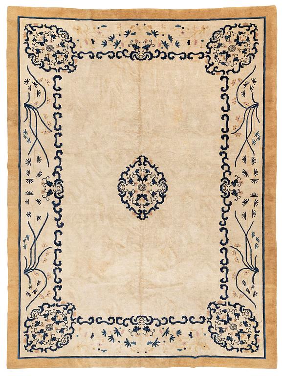 An antique Chinese carpet, 404 x 304 cm.