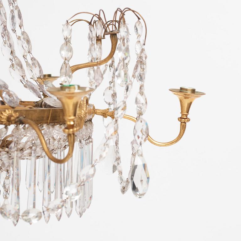 A German Louis XVI gilt-brass and cut-glass six-light chandelier, late 18th century.