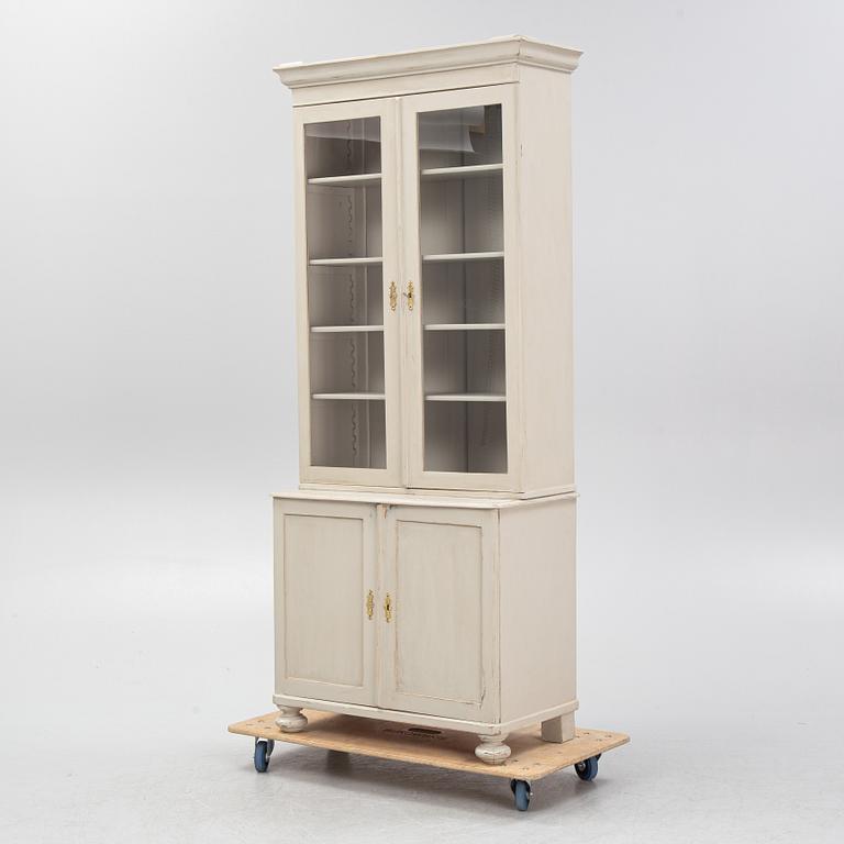 A display cabinet, early 20th Century.