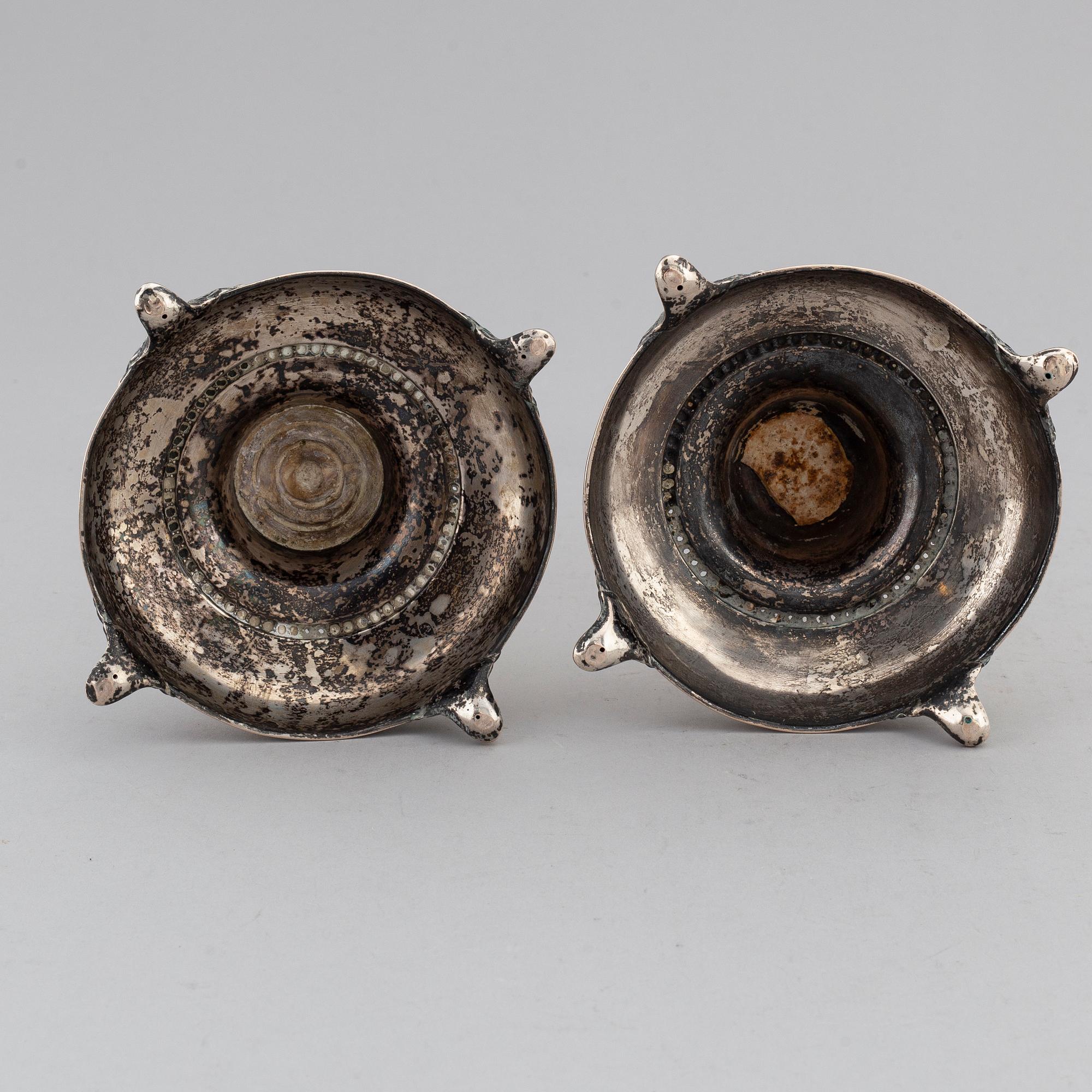 A pair of silver candlesticks, circa 1900.