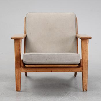 Hans J Wegner, an oak "'GE-290" easy chair from Getama, Denmark.