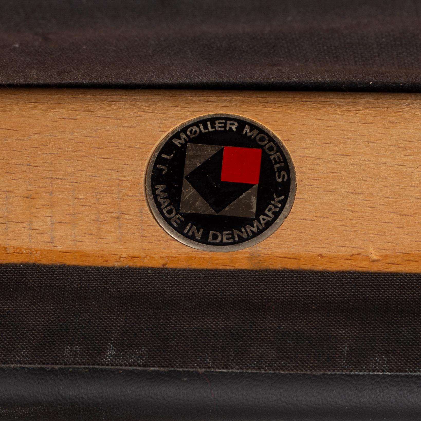 Niels Otto Møller, a rosewood dining table and eight rosewood chairs, Poul Jeppesen & JL Möller, Denmark, 1960's.