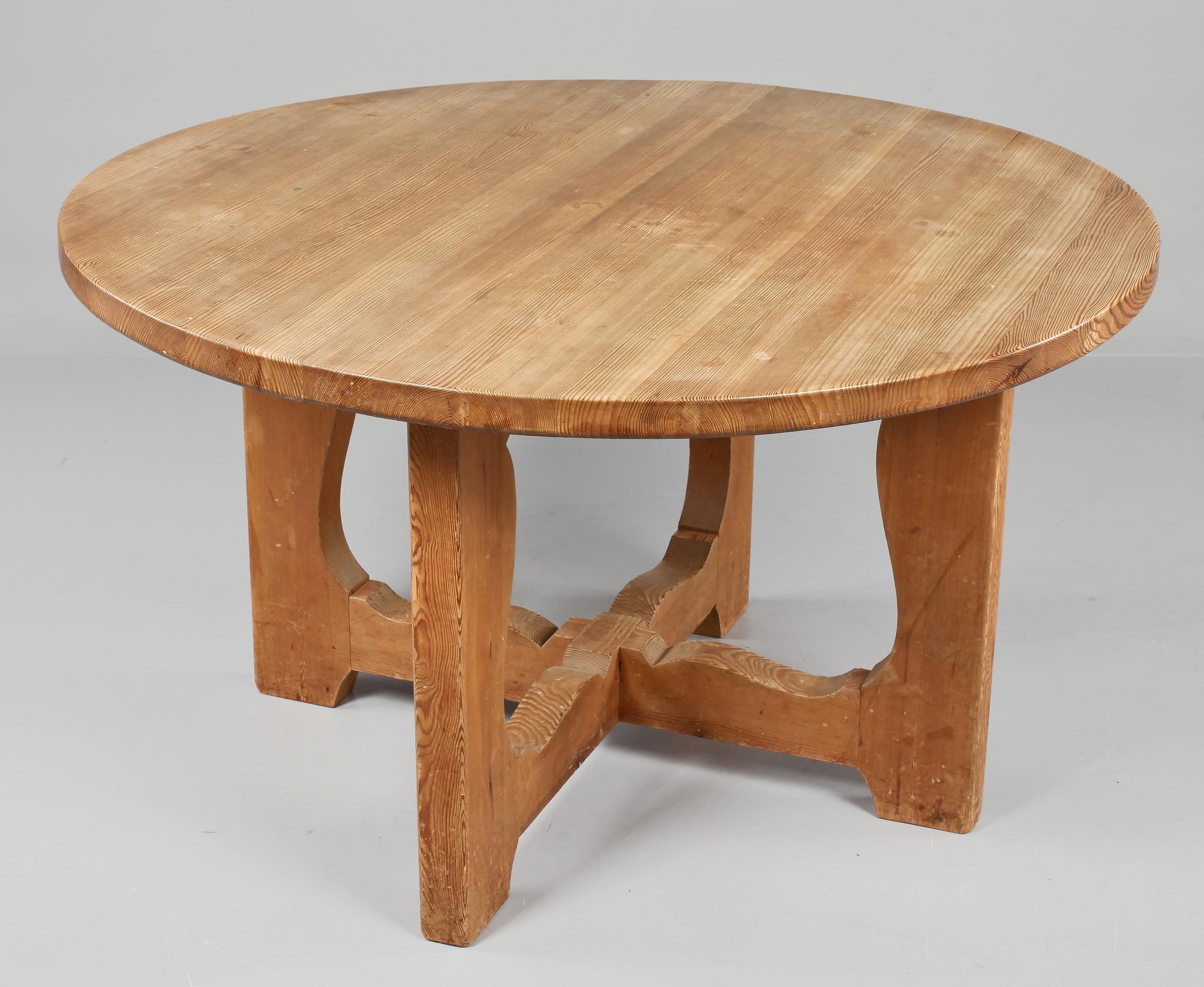 A stained pine dining table, attributed to Axel Einar Hjorth, Nordiska Kompaniet, 1930's.