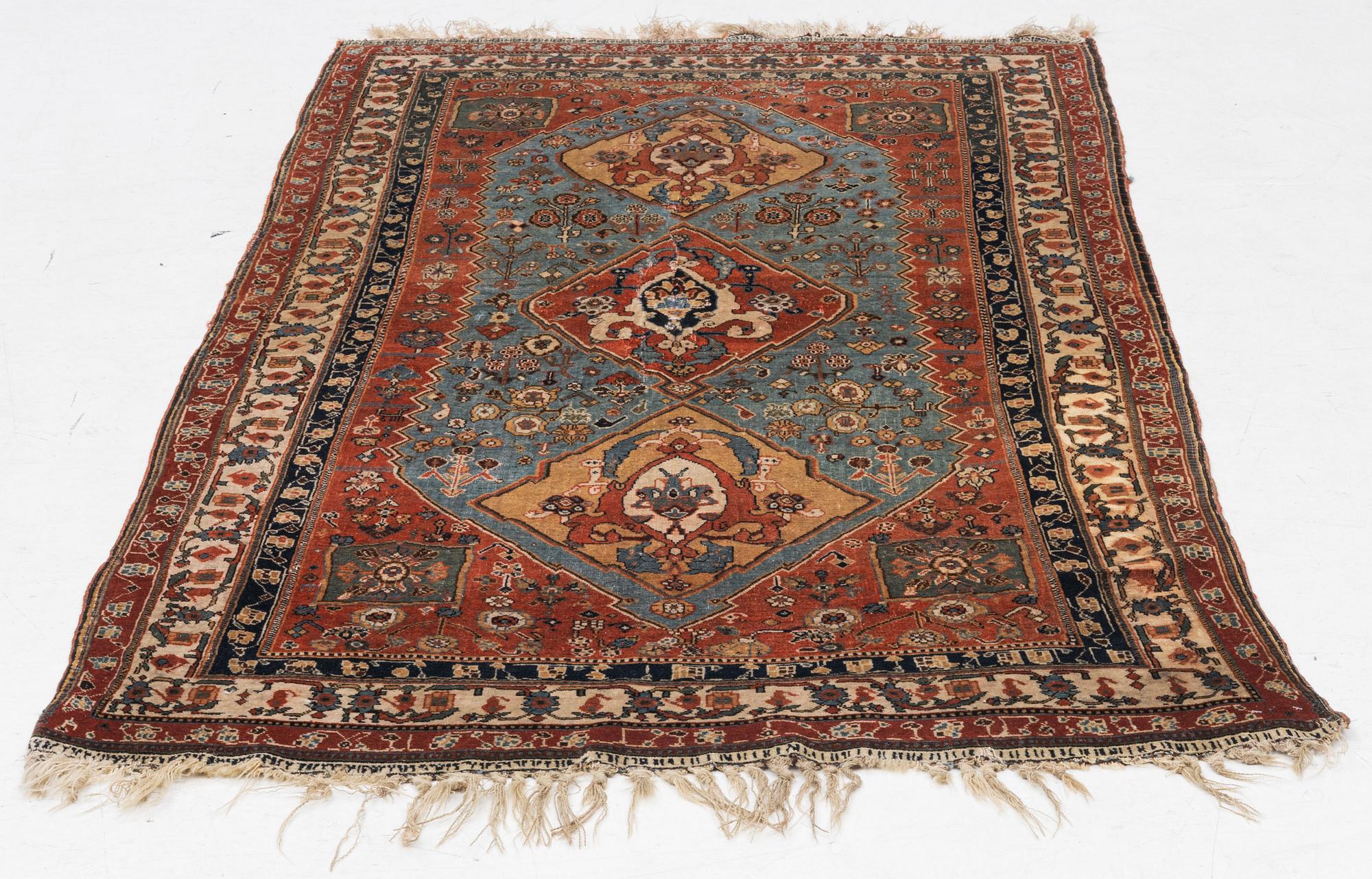 An antique Qashqai rug, southeastern Iran, c 204 x 102 cm.