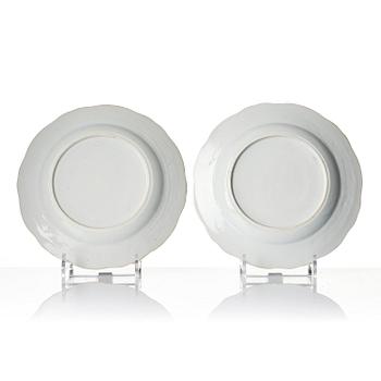 A pair of 'Chinese Export' armorial dinner plates, Qing dynasty, 1790's.