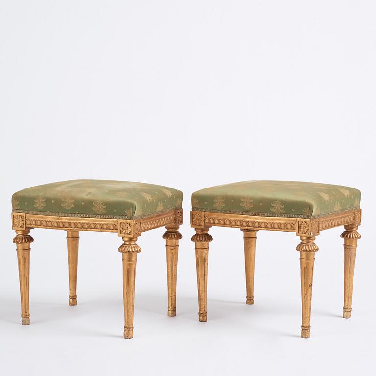 A pair of Gustavian giltwood stools by E. Ståhl (master in Stockholm 1794-1820).