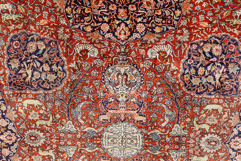 A pictoral orietal silk rug, 246 x 153 cm.