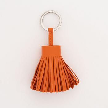 Hermès, a leather bracelet and key chain.