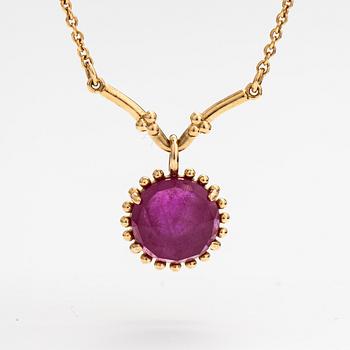 Pandora, a necklace with a lead glass treated ruby.
