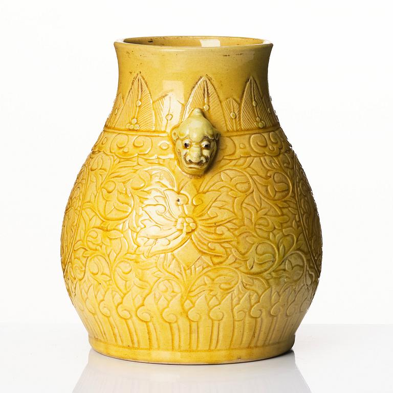 A yellow glazed phoenix vase,  Qing dynasty, with a Kangxi mark.