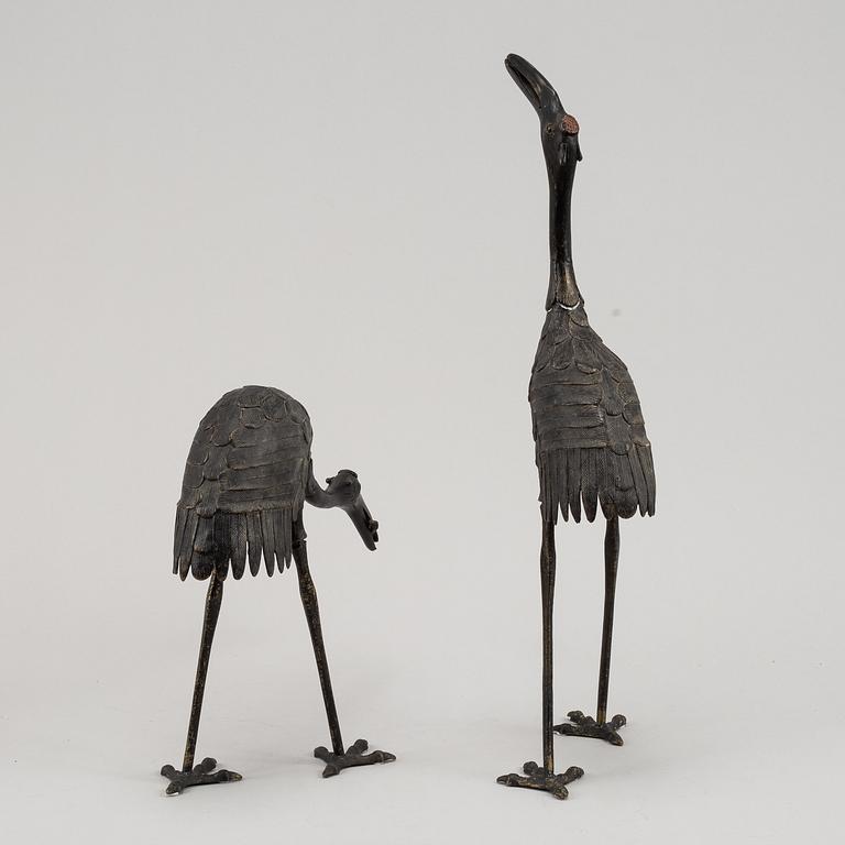 A pair of Chinese metal cranes, first half of the 20th century.