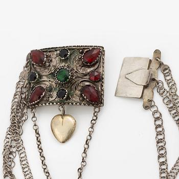 Folk costume jewellery, silver with glass stones.