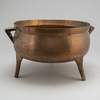 A late 18th or early 19th century bronze and iron pot.