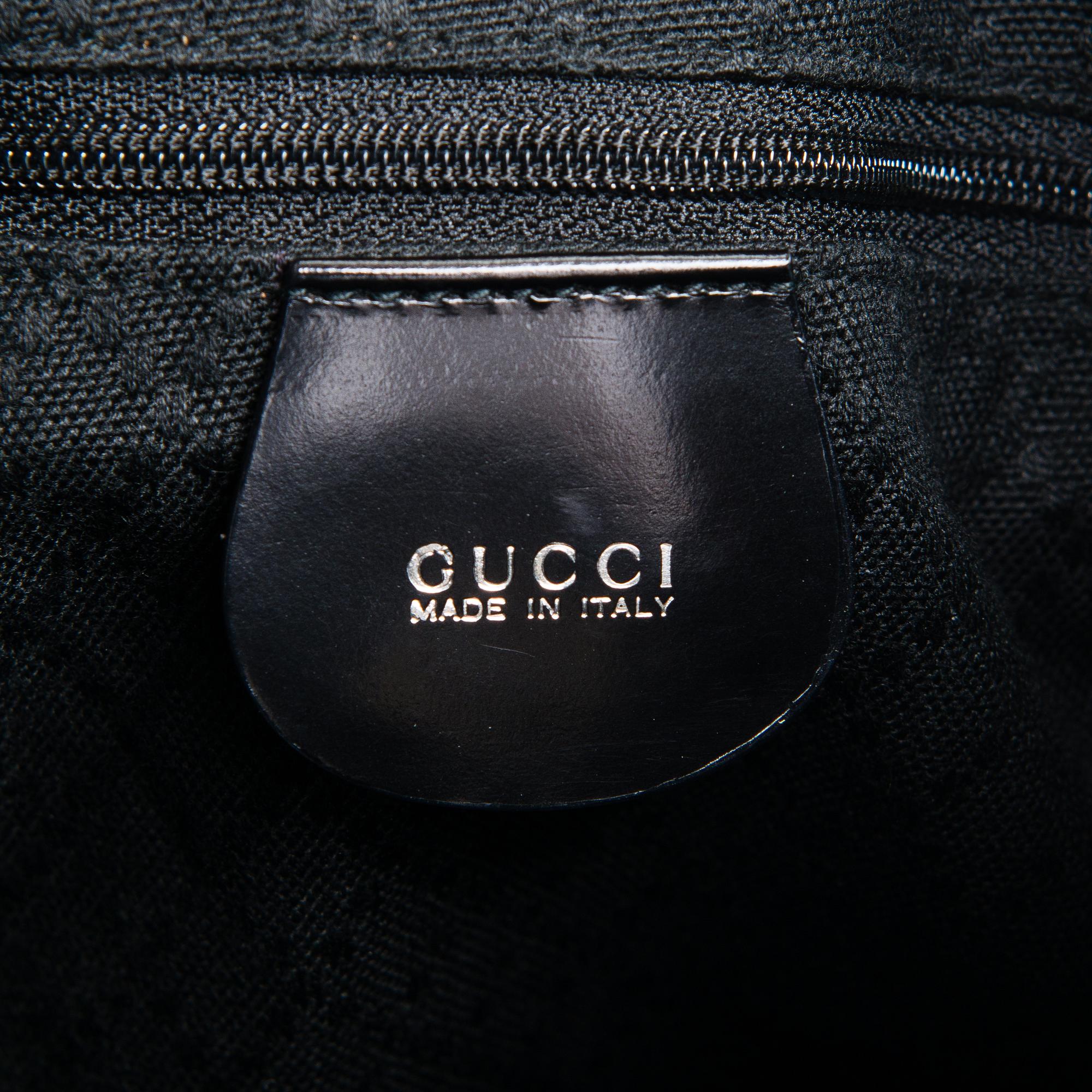 GUCCI, a black nylon handbag.