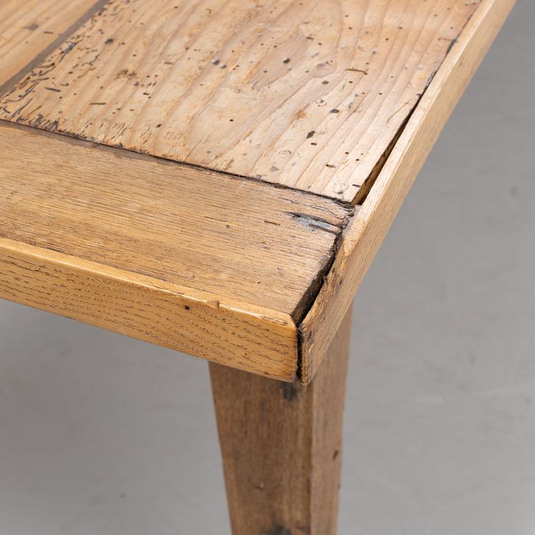 A contemporary French country style dining table.