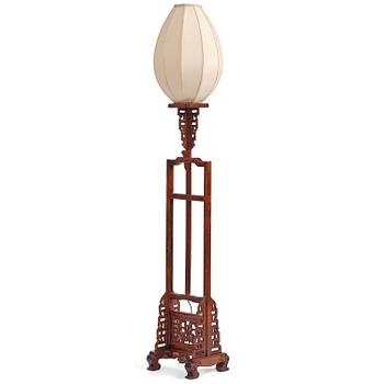 135. A Chinese wooden floor lamp, later part of the 20th century.