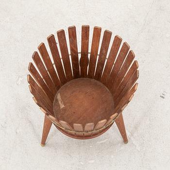 A 1950s teak wastepaper basket.